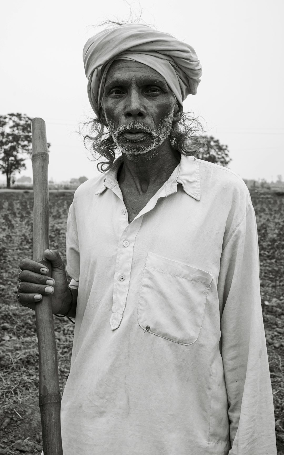 old farmer with tools