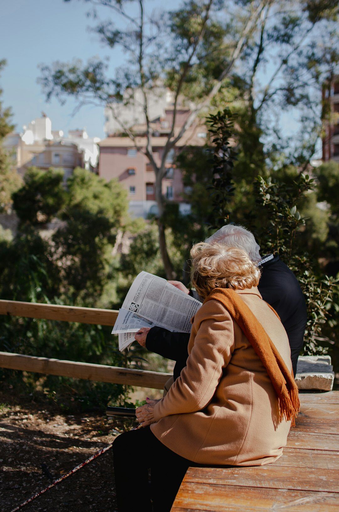 elderly woman reading to children