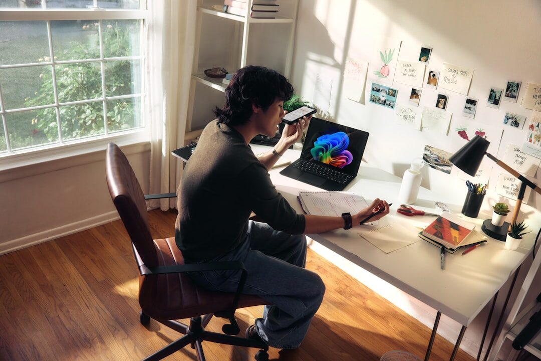 Photo editor working on images on a laptop